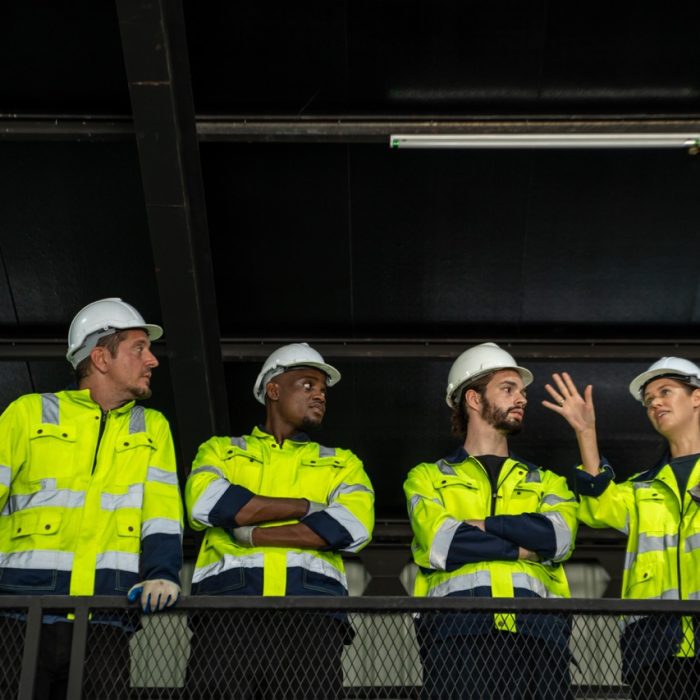 Engineer in intelligent factory industrial check and control automation robot arms machine in factory industrial.