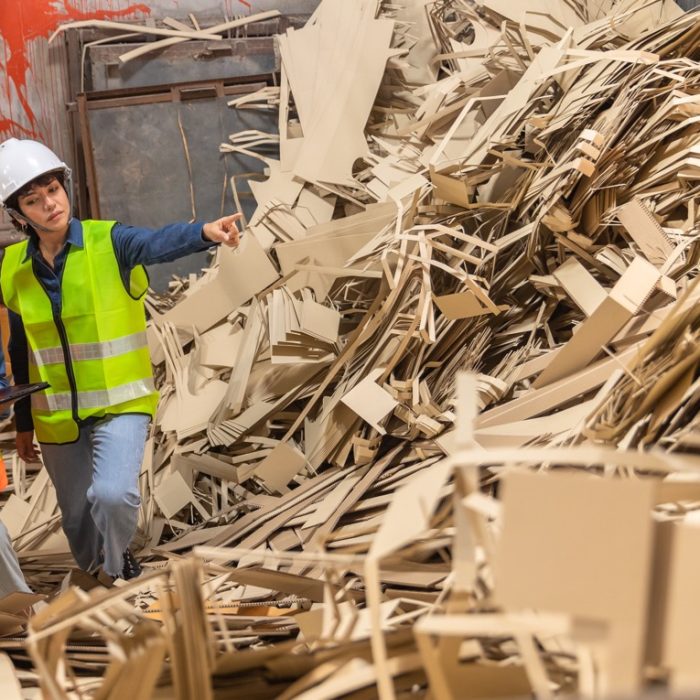 Engineer Standing to work with tablet Machines in the recycling industryl worker indoors in factory.Staff  working in an industrial factory.African  and asian Woman Engineer working and smile