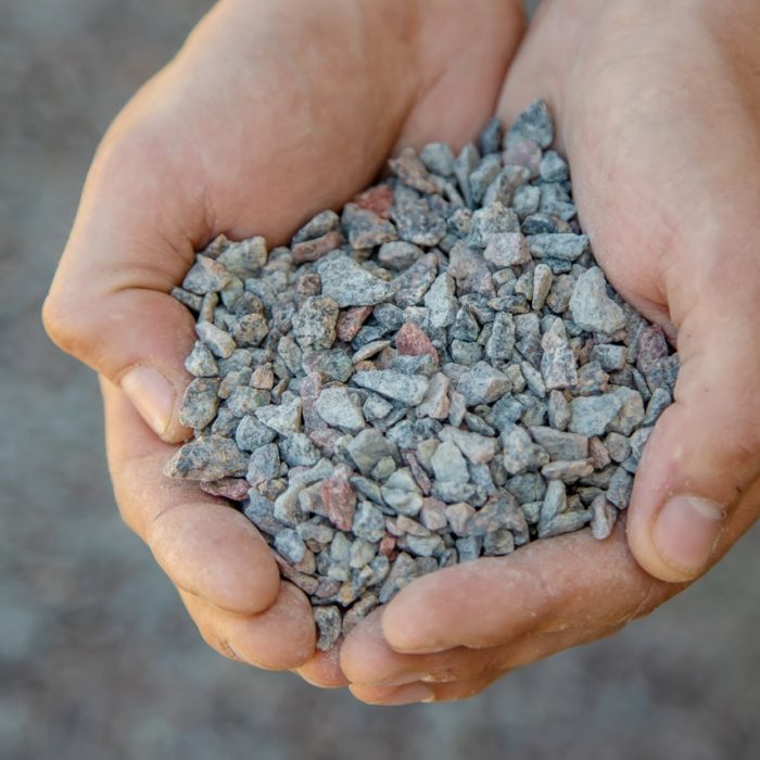 Man holding small rubble in his hands
